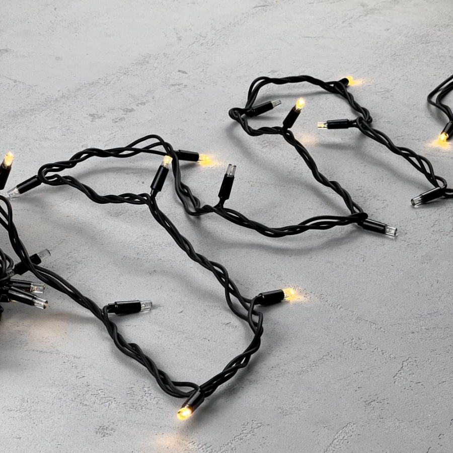 Гирлянда Нить 10м Тепло-Белая с Мерцанием Каждого Диода 220В, 75 LED, Провод Черный Каучук, IP65